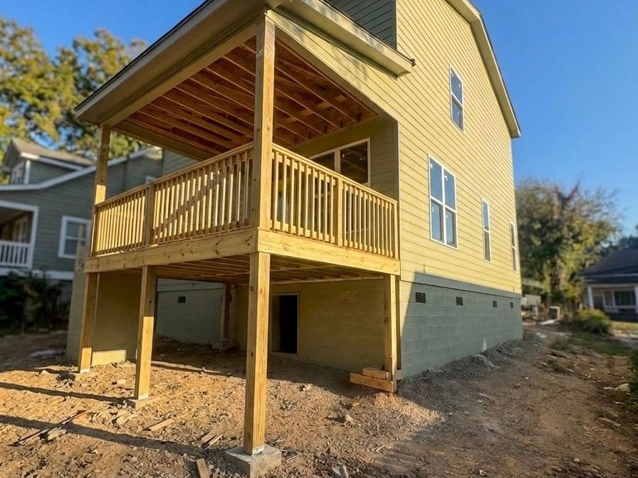 New construction home receiving exterior painting